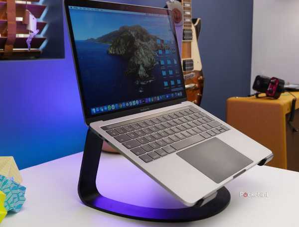A MacBook Pro on a laptop stand. 