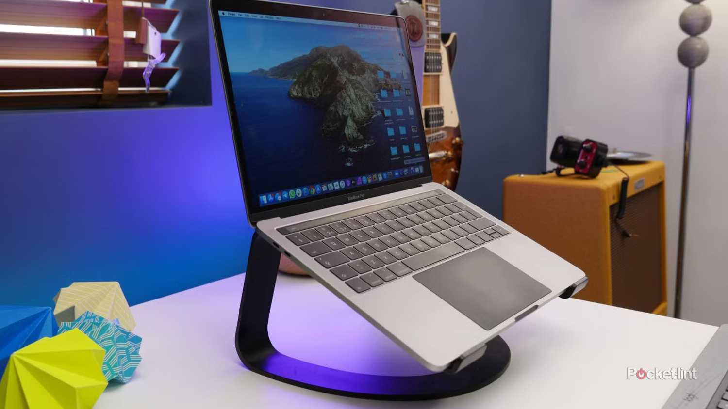 A MacBook Pro on a laptop stand. 