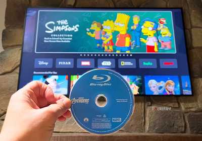 A Blu-Ray Disc in front of the Simpsons on streaming. 