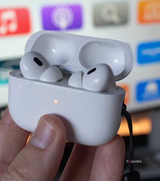 The AirPods Pro 2 in front of a TV.