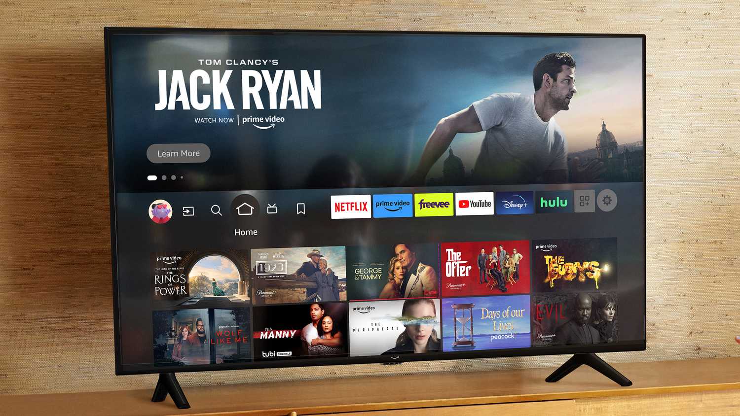 A TV with the Fire TV home screen.