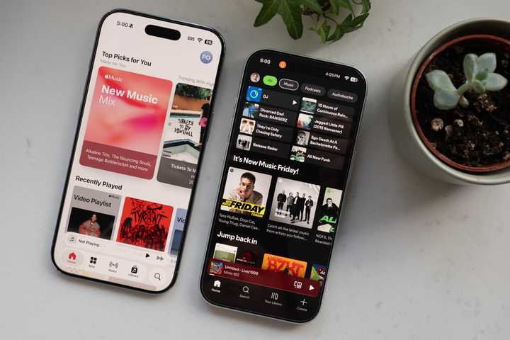 Apple Music and Spotify open on iPhones