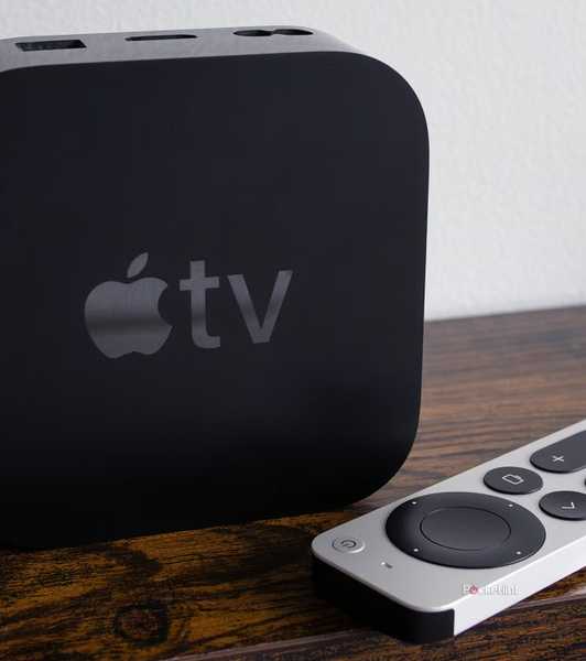 Apple TV 4K and remote on table.