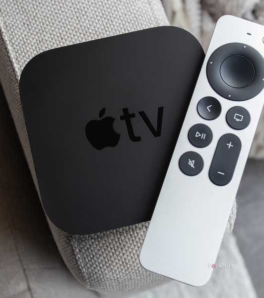 The Apple TV 4K (2021) and the Siri Remote sitting on a couch arm