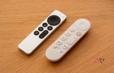 Two streaming remotes next to each other on a table.