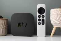An Apple TV 4K and Siri Remote stood upright.