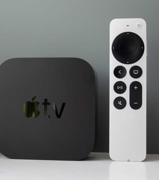 An Apple TV 4K and Siri Remote stood upright.