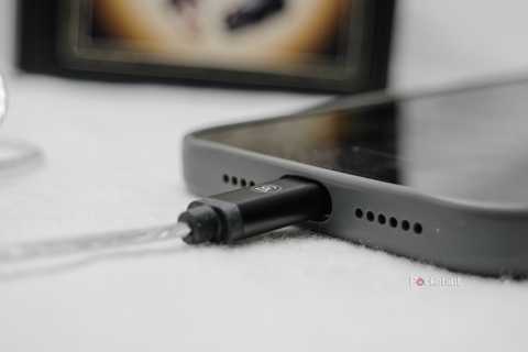 A USB-C cable plugged into an iPhone.