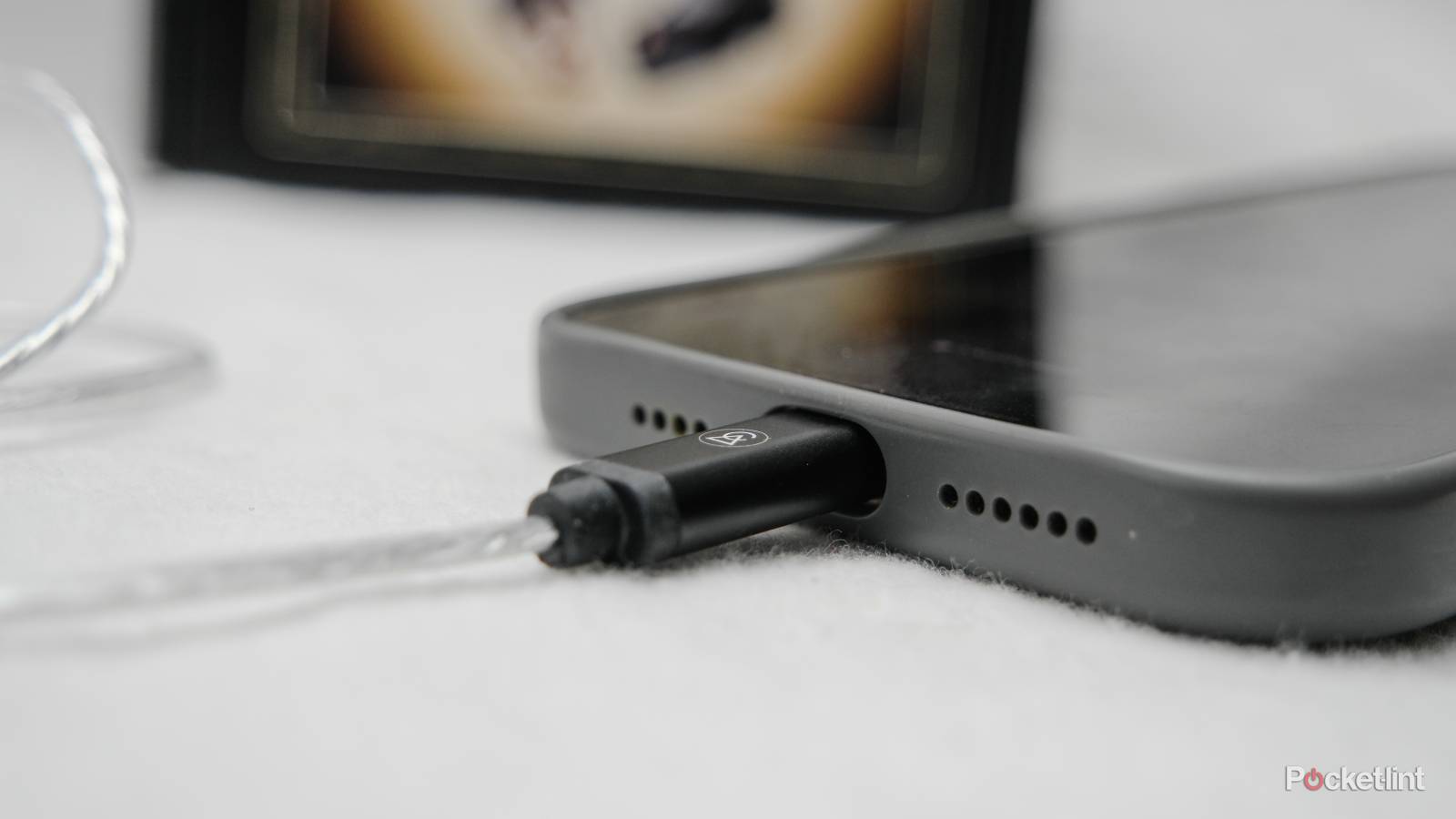 A USB-C cable plugged into an iPhone.