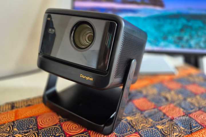 Dangbei DBOX02 Pro Projector on a table. 