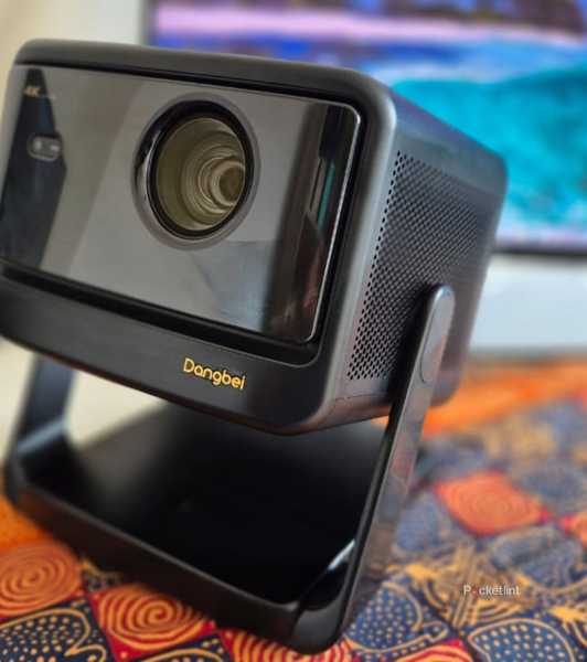 Dangbei DBOX02 Pro Projector on a table. 