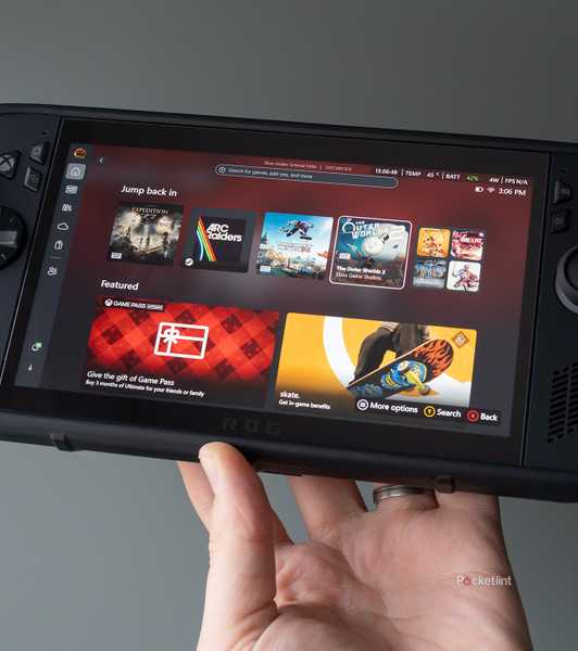 The ROG Xbox Ally X Killswitch case being held in front of a green wall 