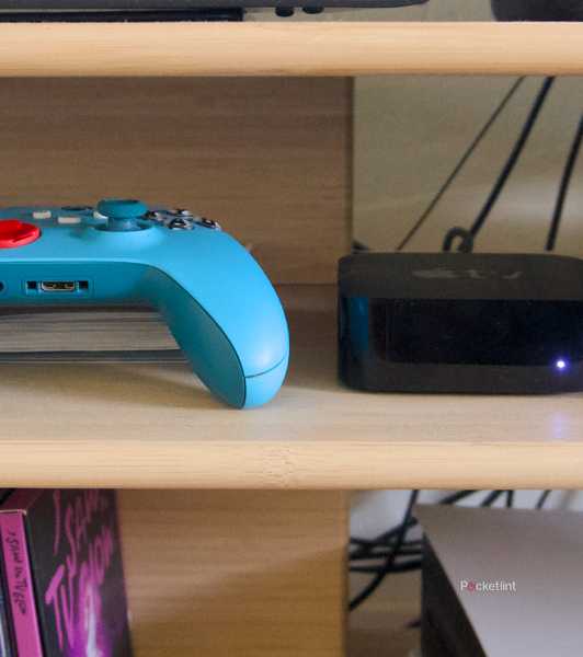 An Xbox game controller next to an Apple TV 4K.