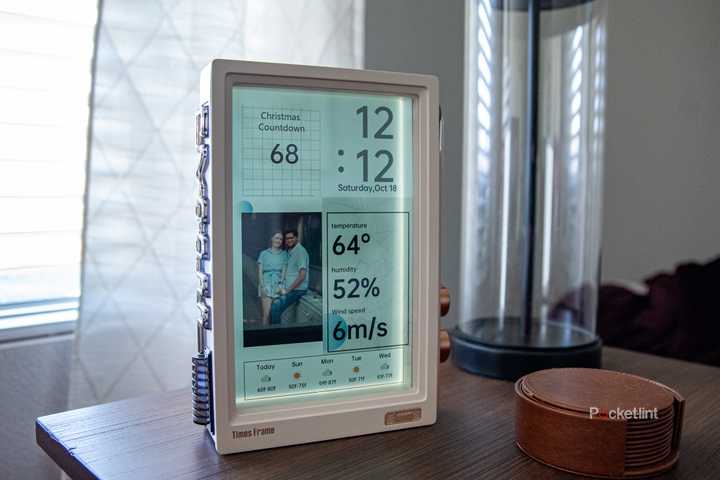 A still photo of the Divoom Times Frame on an end table.