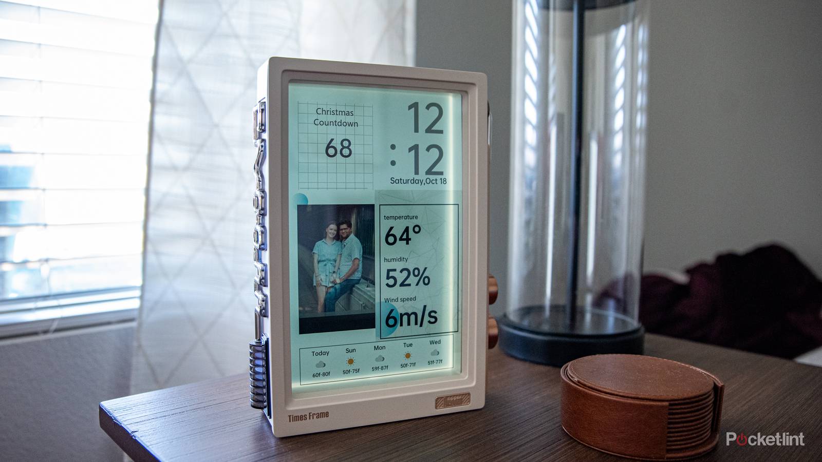 A still photo of the Divoom Times Frame on an end table.