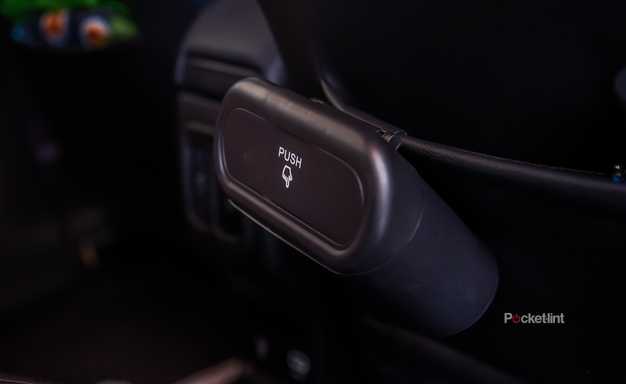 A still photo of the Accor car trash can in the back seat of a Jeep. 