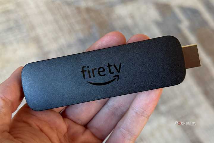 Amazon Fire TV Stick 4K Max in hand.