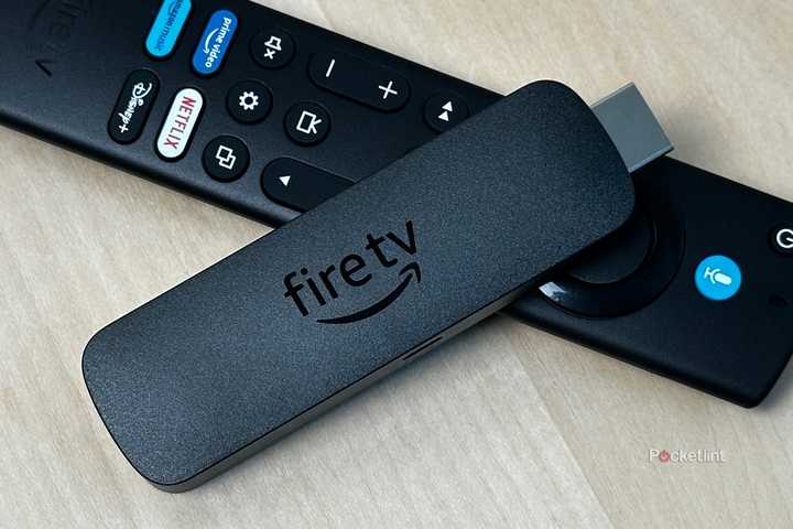 Amazon Fire TV Stick on top of remote.