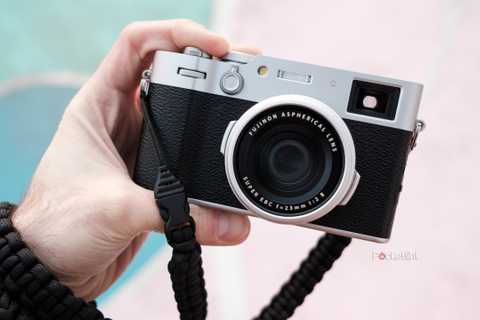 A man holds the X100VI in his hand