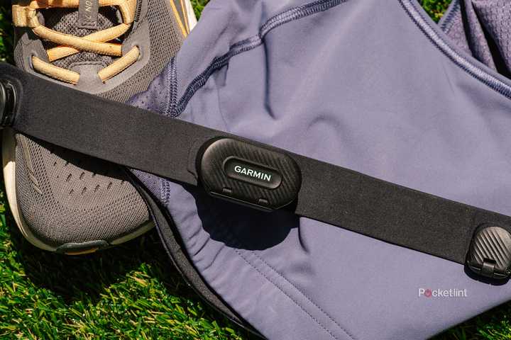 The Garmin HRM-Fit on a sports bra and pair of running shoes. 