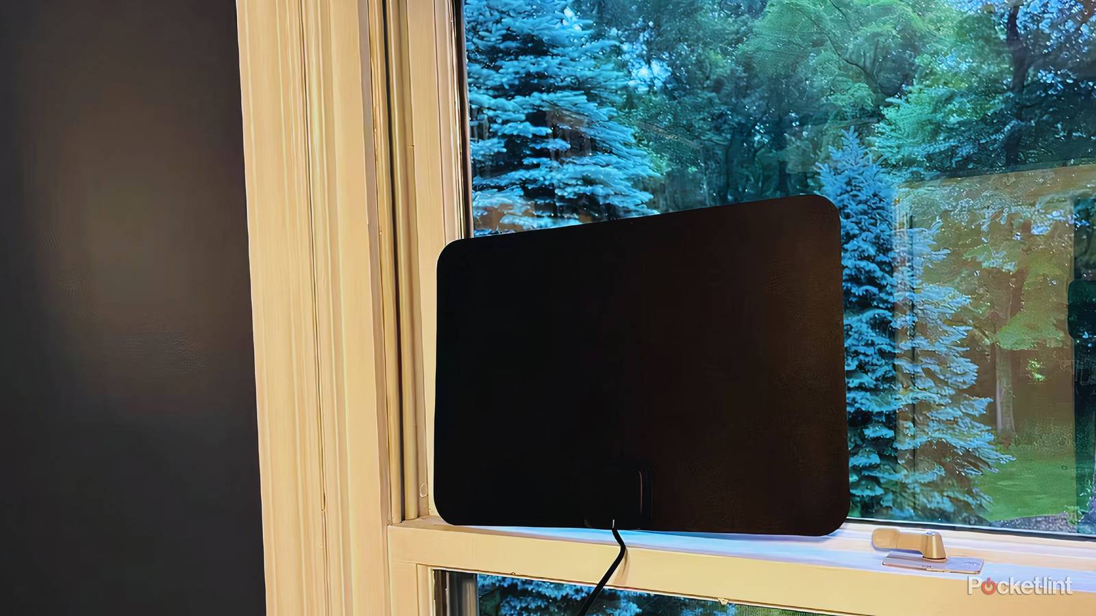 A Gesobyte digital TV antenna mounted in a window.
