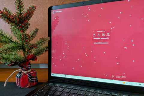 The Holiday Watch PC app running on a Surface Laptop 3.