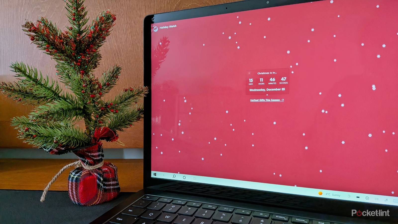 The Holiday Watch PC app running on a Surface Laptop 3.