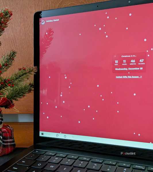 The Holiday Watch PC app running on a Surface Laptop 3.