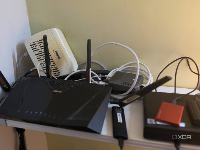 A photo of a router, modem, Raspberry Pi, and Mini PC connected to a home network