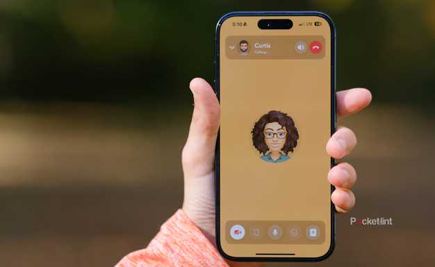 A hand holds an iPhone with a Snapchat video call.