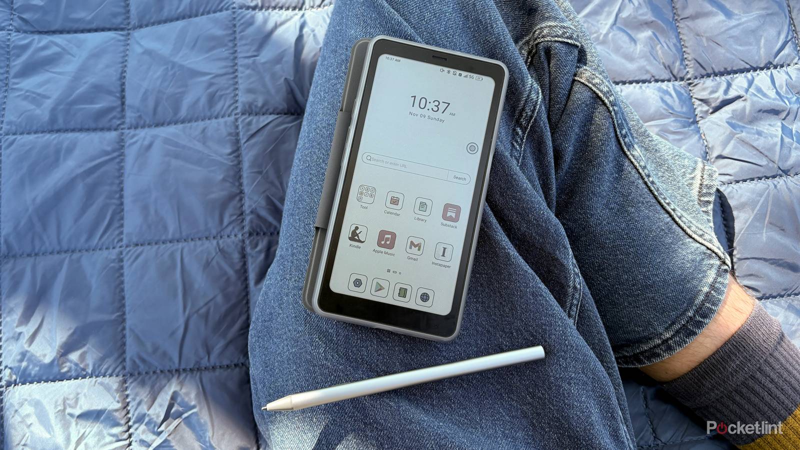 A Palma 2 Pro and InkSense Plus stylus laying on a leg.