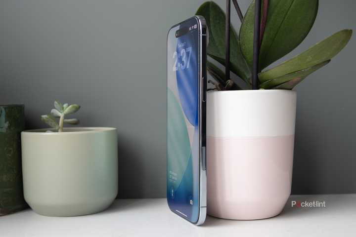 The iPhone Air sitting against a plant