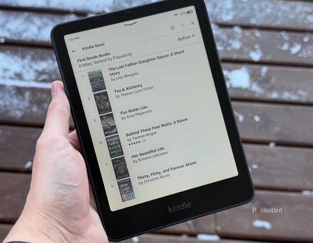 Kindle in front of snow covered deck.