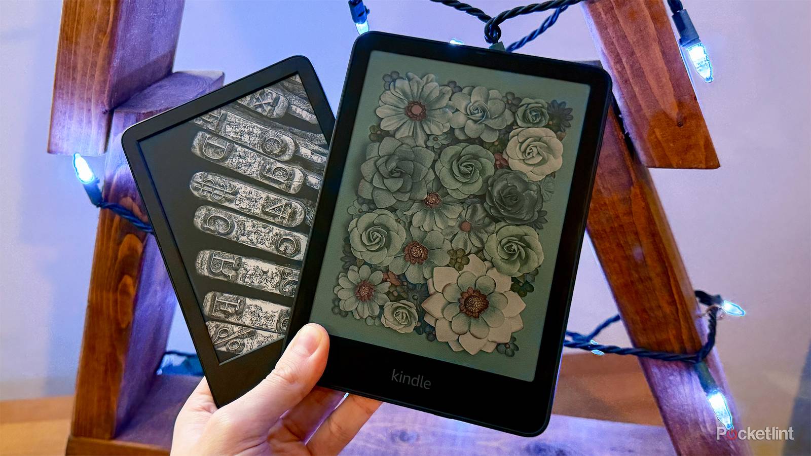 Person holding Kindle and Kindle Colorsoft.