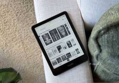 A Kindle Paperwhite on a sofa. 