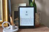 A Kindle Paperwhite in front of burning wood. 