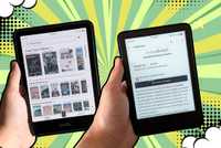 Two Kindles in hand. 