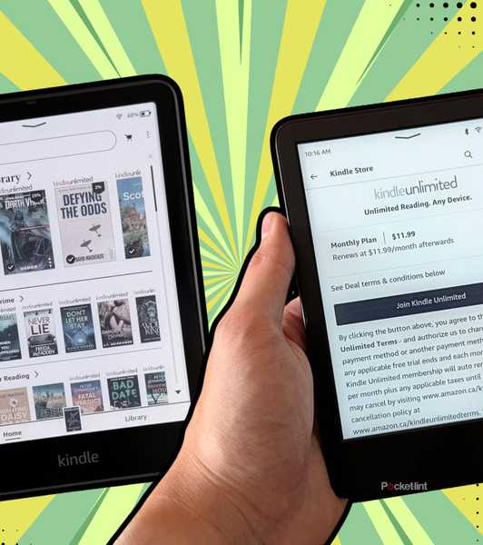 Two Kindles in hand. 