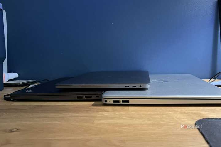 Lenovo, MacBook, and HP laptops showing their USB ports.