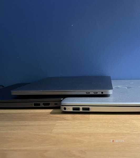 Lenovo, MacBook, and HP laptops showing their USB ports.