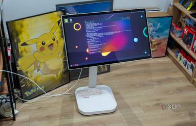 An LG Smart Monitor Swing in front of a few posters