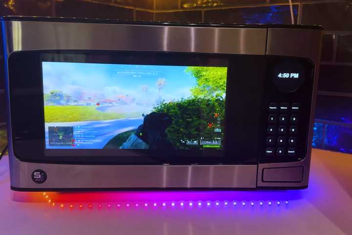 Microwave turned into a PC playing Battlefield 6.