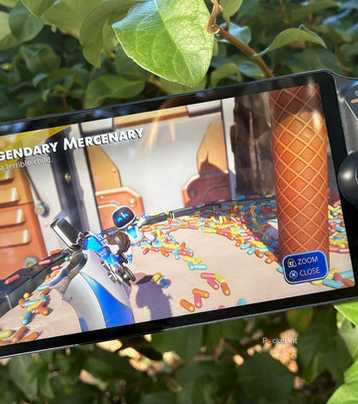 Astro Bot playing on a PlayStation Portal outside