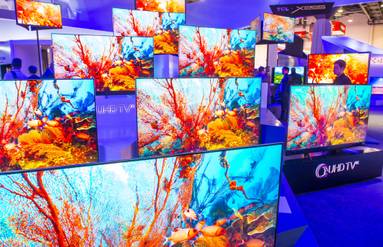 qled tvs on display at tech show.