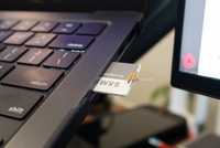 MacBook Pro SD card reader with an SD card in it 