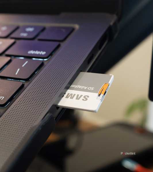MacBook Pro SD card reader with an SD card in it 