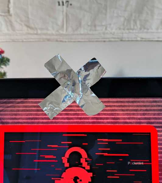 Tin foil covering a webcam in an X. 