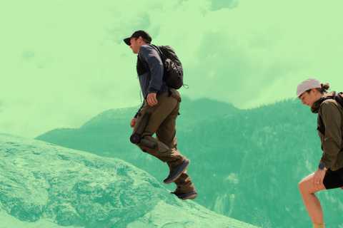 Someone wearing the Skip MO/GO and walking uphill.