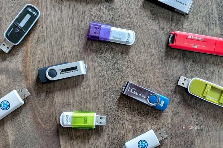 An assortment of USB flash drives on a table.