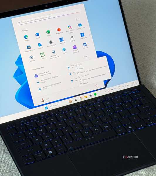 Windows Start Menu on Windows 11 laptop on table.